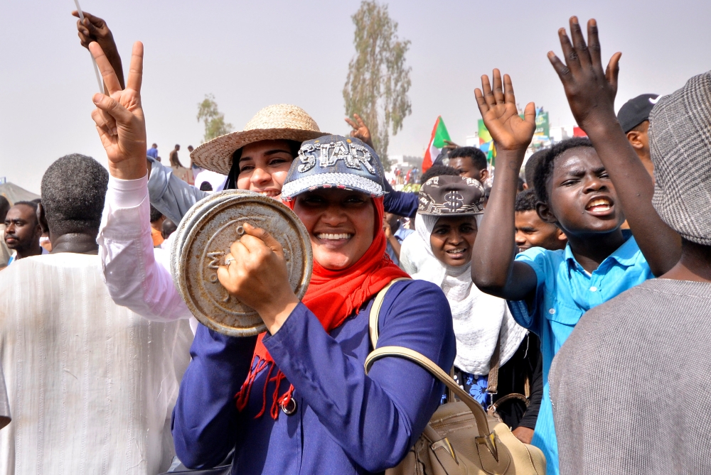 Sudanese demonstrators chant slogans along the streets after Sudan’s Defense Minister Awad Mohamed Ahmed Ibn Auf said that President Omar Bashir had been detained “in a safe place” and that a military council would run the country for a two-year transitional period in Khartoum, Sudan, on Thursday. — Reuters