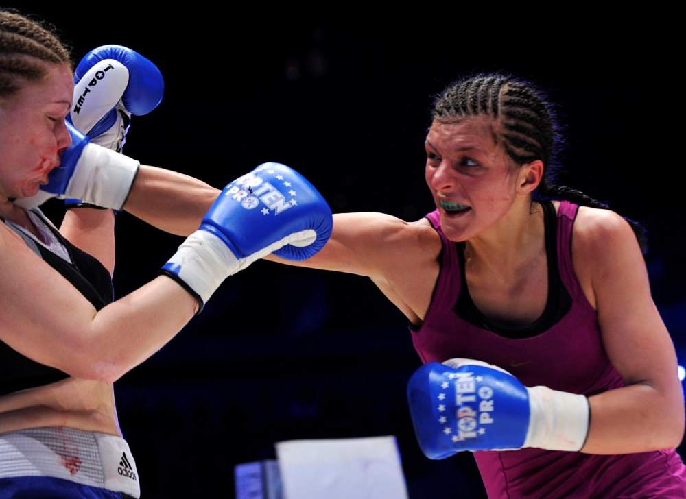 File photo shows Christina Hammer of Germany (R) punching Diana Kiss of Hungary at the WBF World Championship Middleweight title fight in Ljubljana. — Reuters