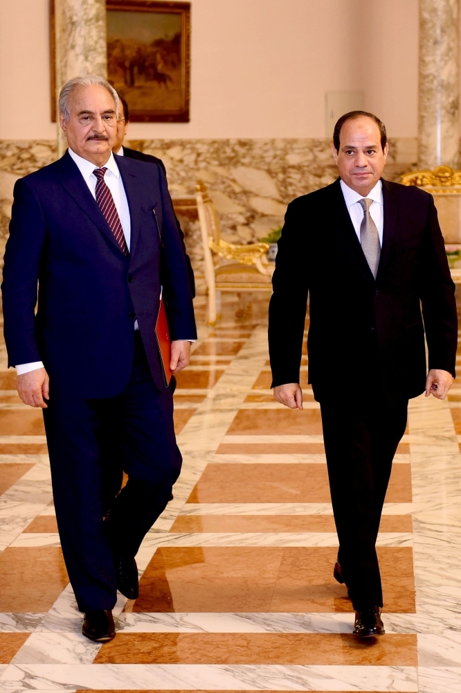 Egyptian President Abdel Fattah El-Sisi (right) meeting Libyan strongman Khalifa Haftar at the Ittihadia Presidential Palace in the capital Cairo, Sunday. — AFP