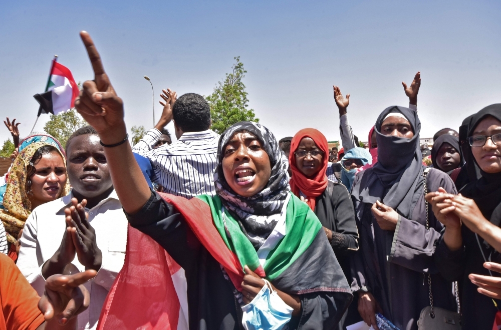 Sudanese demonstrators gather near the military headquarters in the capital Khartoum on Monday. — AFP