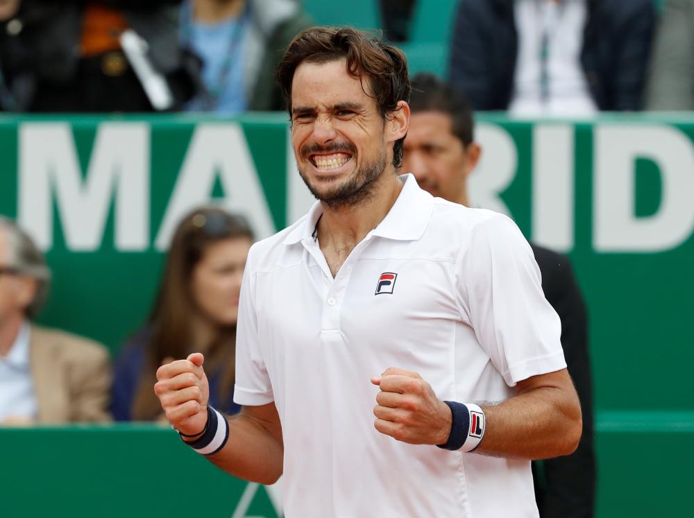 Argentina’s Guido Pella celebrates winning his second round match against Croatia’s Marin Cilic at the Monte Carlo Masters Tuesday. — Reuters