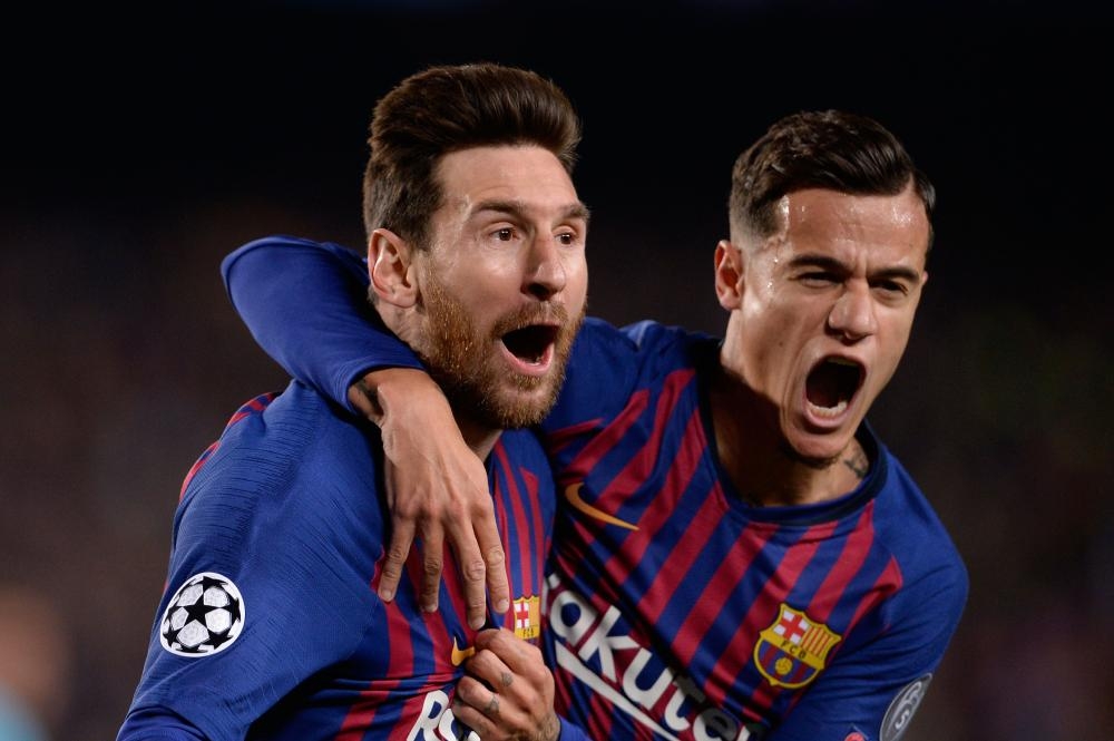 Barcelona’s Lionel Messi (L) celebrates with Philippe Coutinho after scoring a goal during the UEFA Champions League quarterfinal second leg match against Manchester United at the Camp Nou Stadium in Barcelona Tuesday. — Reuters 