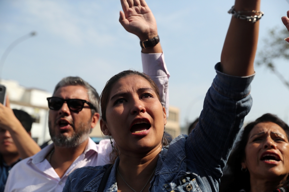 Supporters of Peru’s former President Alan Garcia react as they try to enter a hospital where Garcia was taken after he shot himself, in Lima, Peru, on Wednesday. — Reuters