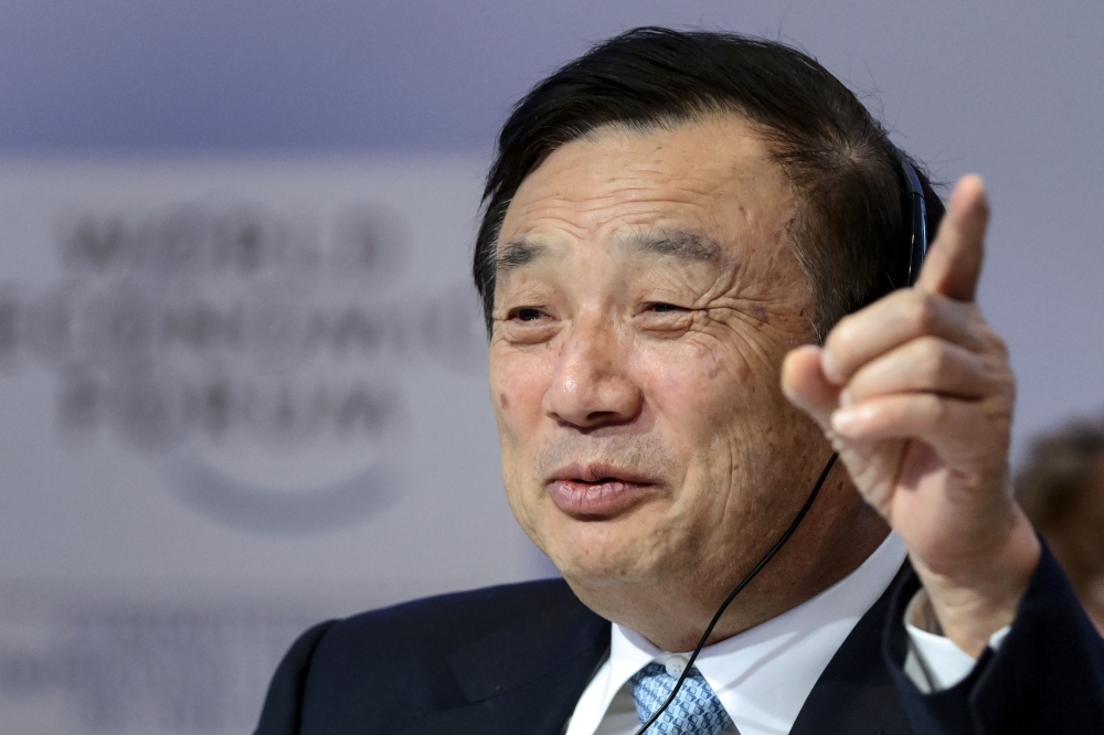 In this file photo, Huawei Founder and CEO Ren Zhengfei gestures as he attends a session of the World Economic Forum (WEF) annual meeting in Davos.  — AFP