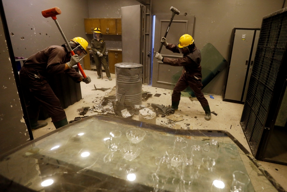 Jordanian people smash items at AXE Rage Room where they can express their anger in an entertaining way in Amman. — Reuters