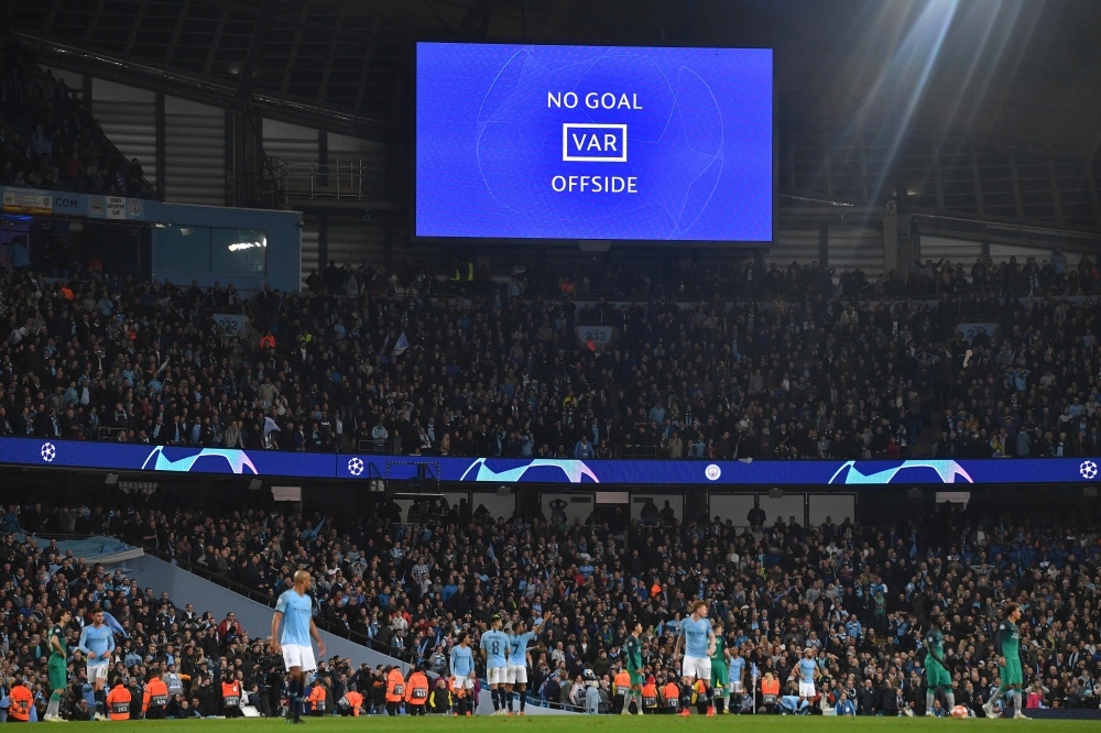 A screen shows the VAR decision announcing that Manchester City's English midfielder Raheem Sterling's goal has been dissallowed in the closing minutes of the UEFA Champions League quarterfinal second leg football match between Manchester City and Tottenham Hotspur at the Etihad Stadium in Manchester, north west England on Wednesday. The match ended 4-4, but Tottenham progress to the semi finals on goal difference. — AFP