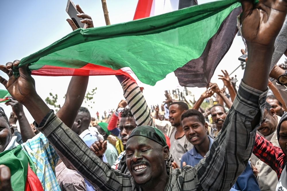 Sudanese protesters shout slogans during a protest outside the army complex in the capital Khartoum on Thursday. — AFP