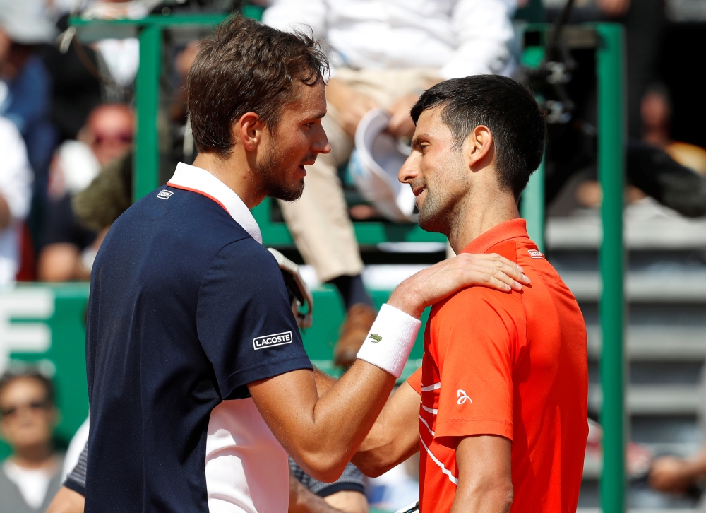 Russia's Daniil Medvedev with Serbia's Novak Djokovic after winning their quarterfinal match of the ATP 1000 - Monte Carlo Masters at the Monte-Carlo Country Club, Roquebrune-Cap-Martin, France, on Friday. — Reuters 