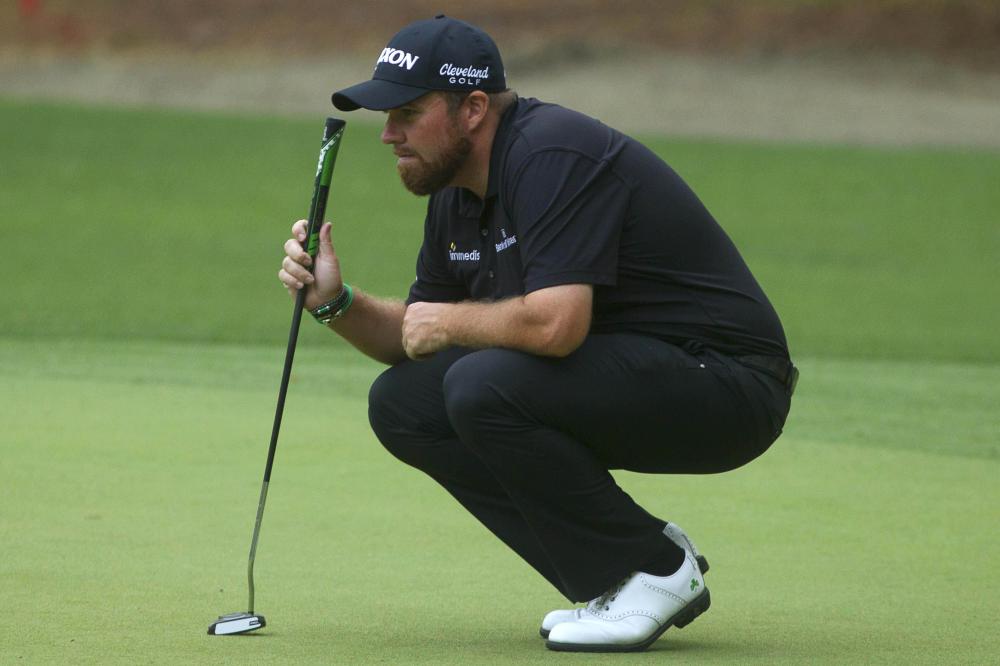 Shane Lowry inspects the green of the fifteenth hole during the second round of the RBC Heritage Golf Tournament at Harbour Town Golf Links Hilton Head, US, Friday. — Reuters 