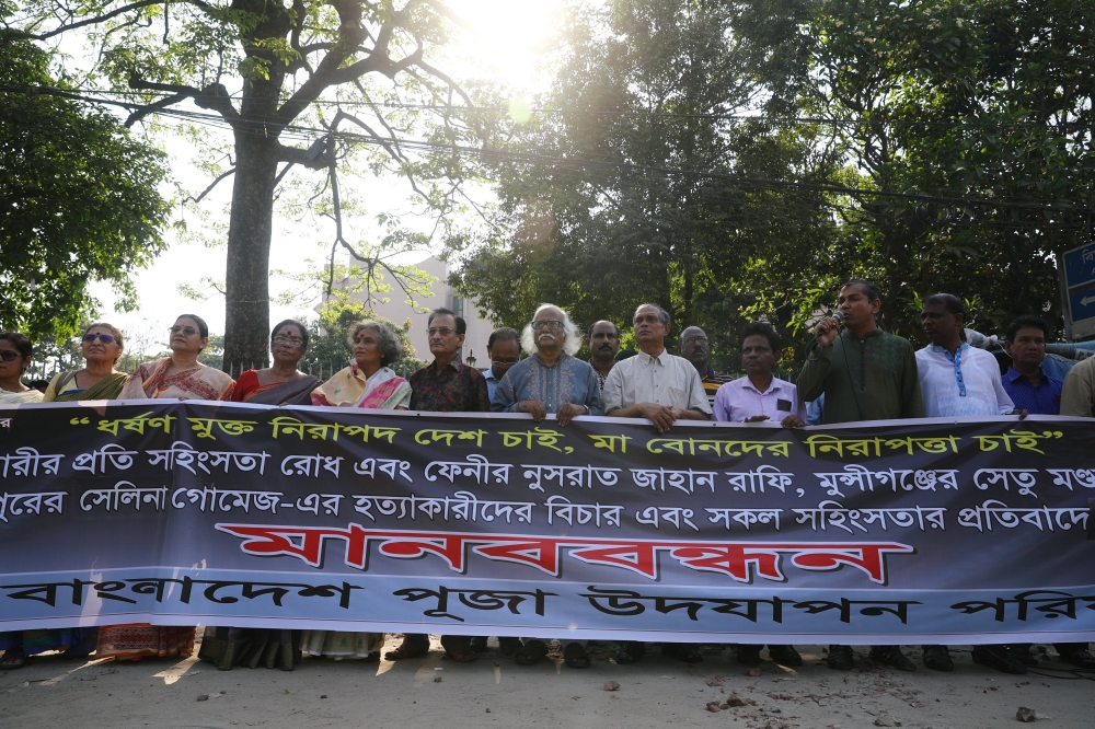 People make a human chain to demand justice for an 18 year old woman who was killed after she was set on fire for refusing to drop a sexual harassment case against her Islamic school teacher in Dhaka, Bangladesh, on Saturday. — Reuters