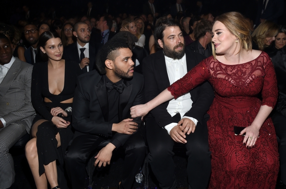 Adele (R) and her husband, charity entrepreneur Simon Konecki (2R) attend The 58th GRAMMY Awards at Staples Center in Los Angeles, California.  — File photo