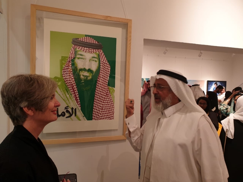 


Saudi artist Hisham Binjabi speaking to Al-Jawhara about the Hope poster during the “Nawat Al Fun Members” exhibition.