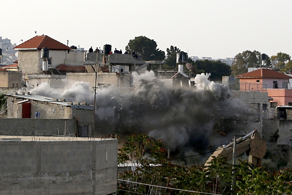 TOPSHOT - Israeli forces blow up the family house of Palestinian assailant Omar Abu Laila, in Az-Zawiya village, in the Israeli-occupied West Bank, on Wednesday. — AFP