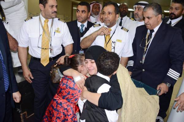 Hajar, the Moroccan air hostess with Saudia who was seriously injured in Sunday's terrorist attack in Sri Lanka, hugs her children when she arrived at Jeddah airport on Thursday evening.