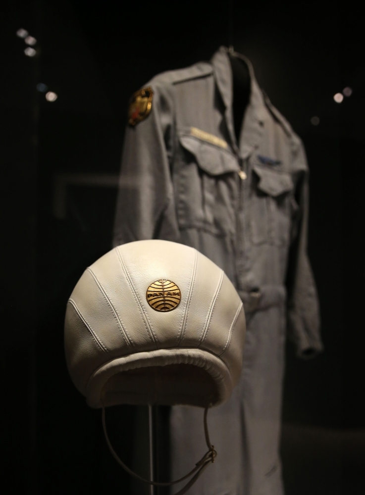 A Pan American 'bump' hat with the original golden company logo and Discovery flight overall which was worn by Keir Dullea as Dave Bowman in the film '2001: A Space Odyssey' (1968), is displayed as part of the Stanley Kubrick exhibition at the Design Museum in Kensington, London. — AFP