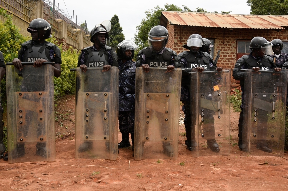 Uganda’s anti-riot policemen stand guard in front of the house of Ugandan musician turned politician, Robert Kyagulanyi, commonly known by his stage name Bobi Wine in Kampala, on April 23, 2019. — AFP