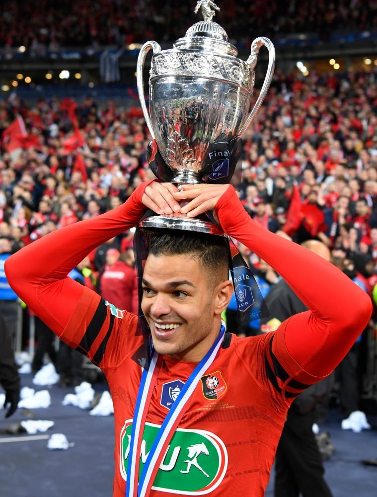 Rennes' French forward Hatem Ben Arfa celebrates with French Cup at the Stade de France in Saint-Denis Monday. — AFP 