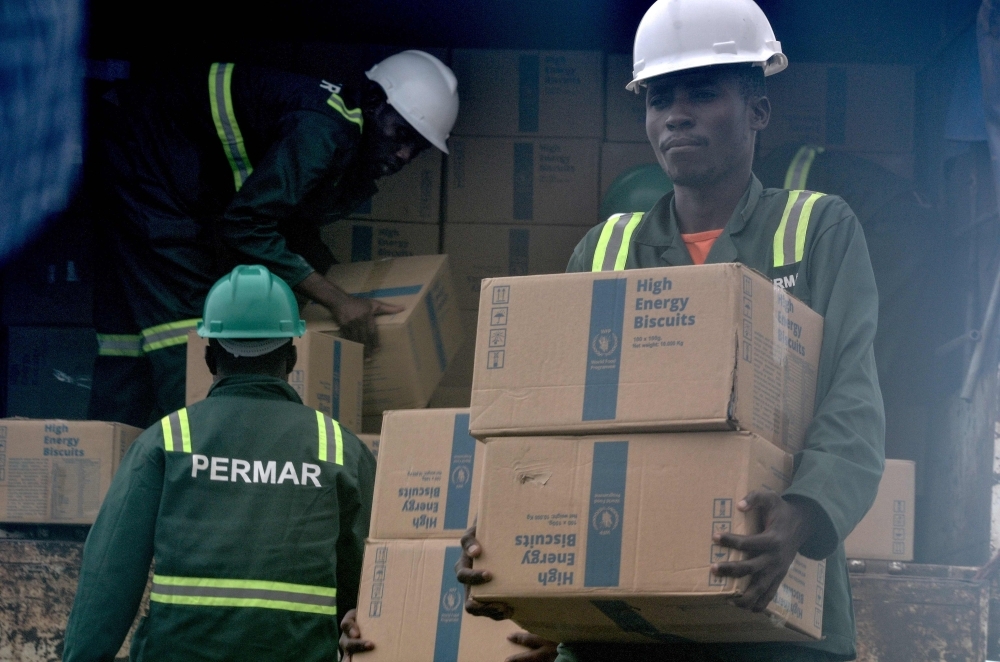 Aid is unloaded off a truck and taken to a waiting World Food Programme (WFP) helicopter to be deliver to Ibo Island and Quissanga in northern Mozambique on Tuesday. — AFP