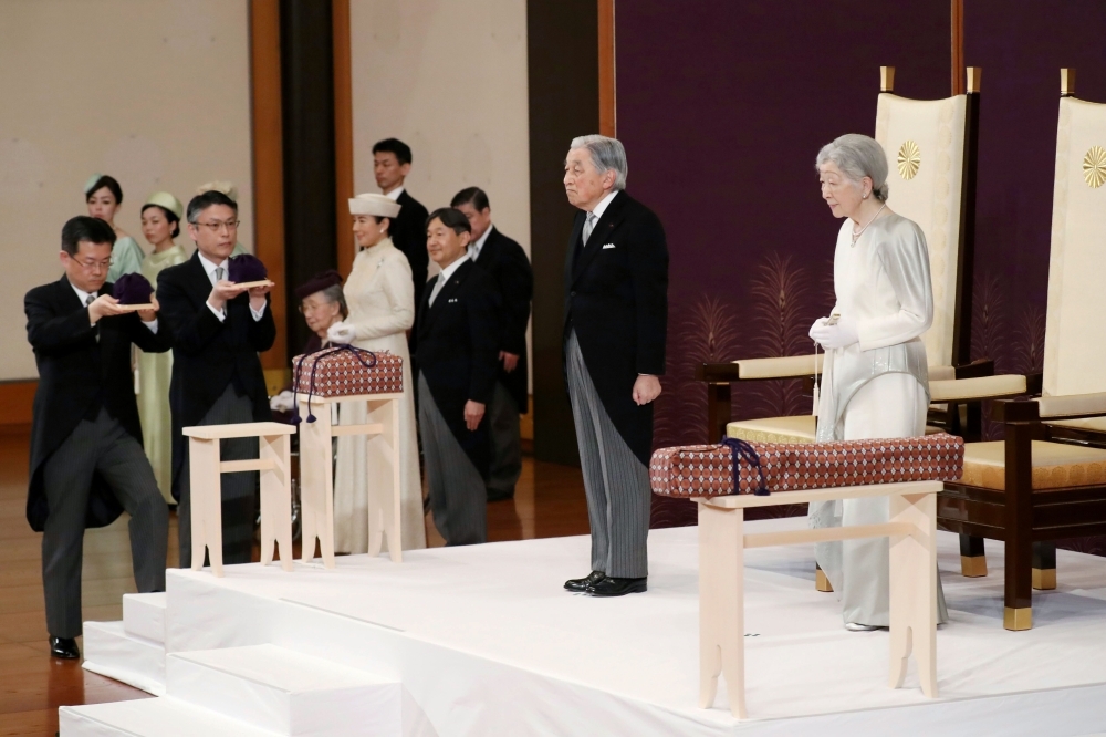 Japan’s Emperor Akihito, second right, Empress Michiko, right, Crown Prince Naruhito, third right, and his wife Crown Princess Masako, fourth right, attend the abdication ceremony at the Matsu-no-Ma state room in the Imperial Palace in Tokyo on Tuesday. — AFP