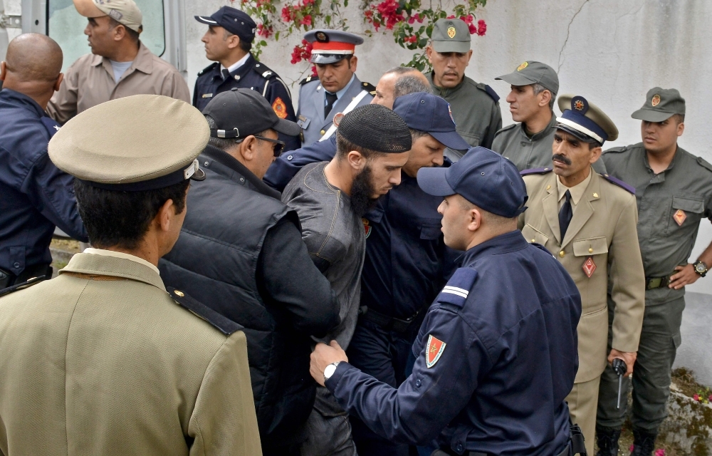 A suspect, in the murder of two Scandinavian hikers, arrives for his trial at a Moroccan court in Sale near the capital Rabat on Thursday. — AFP