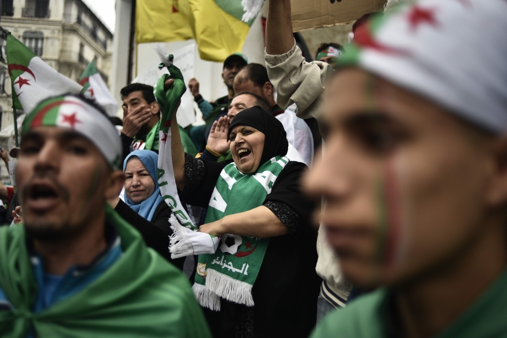 Algerian protesters shout slogans during a demonstration in the capital Algiers on Friday. — AFP