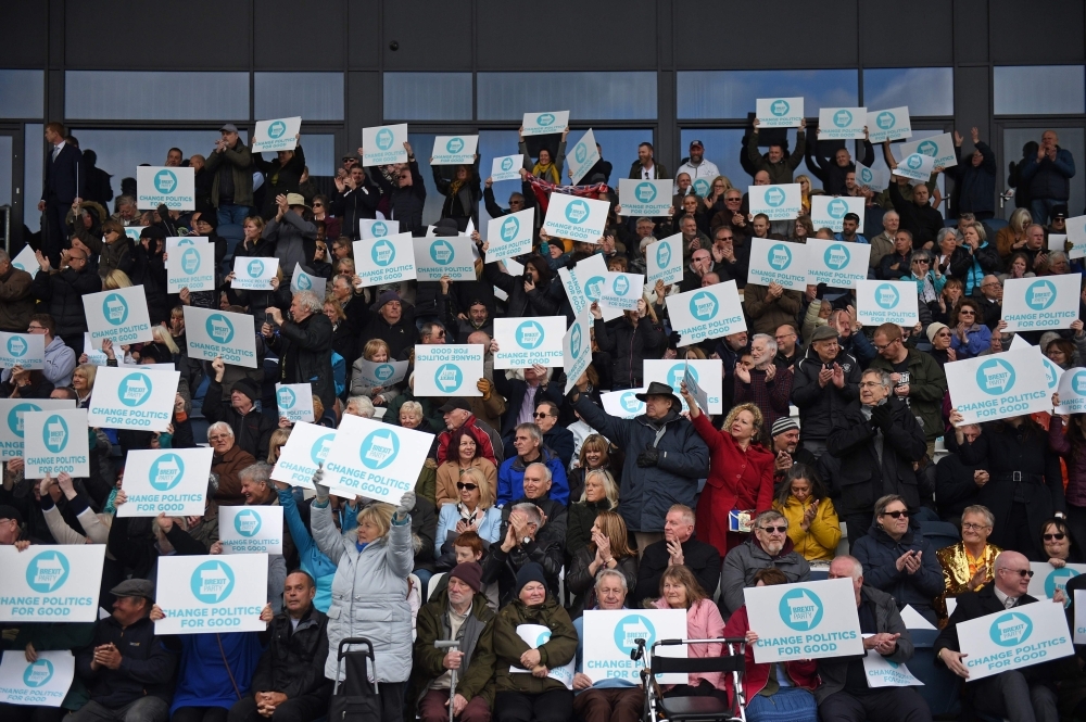 Brexit Party supporters hold up placards during a rally with the Brexit Party's north west candidates in Fylde, north west England on Sunday, in the build up to the European elections. — AFP
