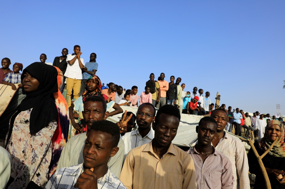 Sudanese protesters attend a demonstration in front of the defense ministry compound in Khartoum, Sudan, on Sunday. — Reuters