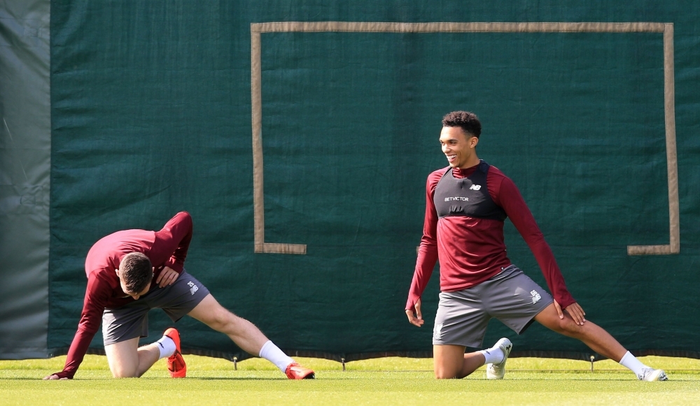 Liverpool's English midfielder James Milner (L) and Liverpool's English defender Trent Alexander-Arnold take part in a team training session at Melwood in Liverpool, north west England on Monday, on the eve of their UEFA Champions League semifinal second leg football match against Barcelona. — AFP
