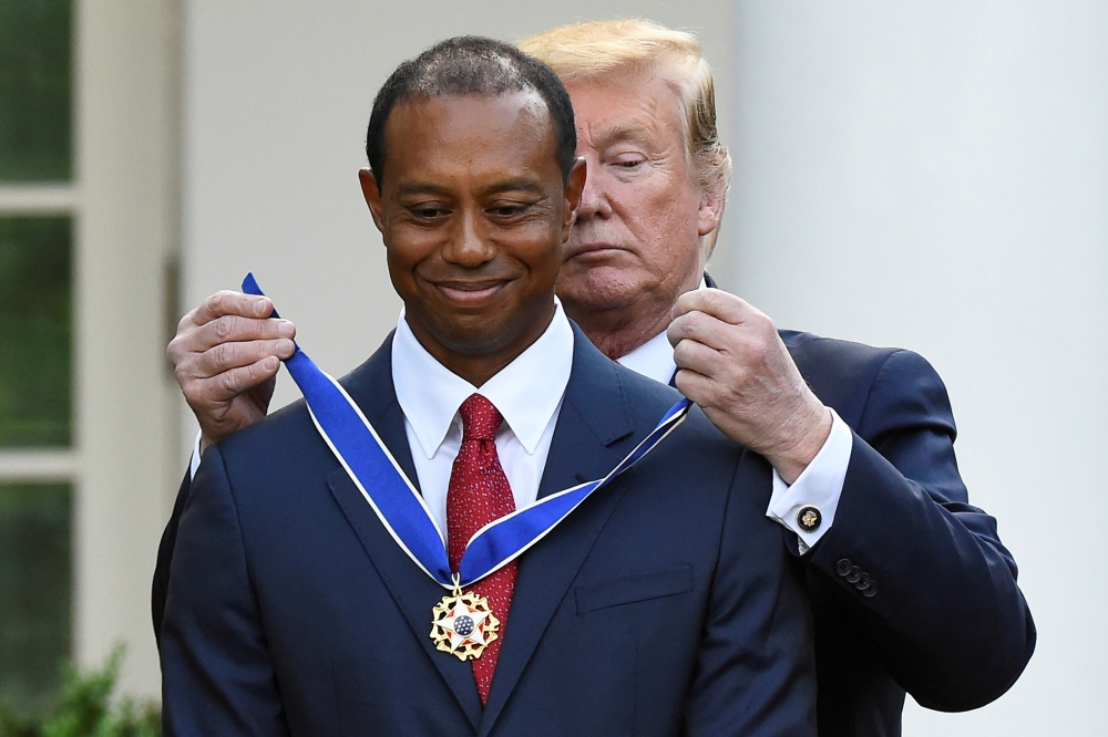 Golfer Tiger Woods is awarded the Presidential Medal of Freedom, the nation's highest civilian honor, by US President Donald Trump in the Rose Garden at the White House in Washington on Monday. — Reuters