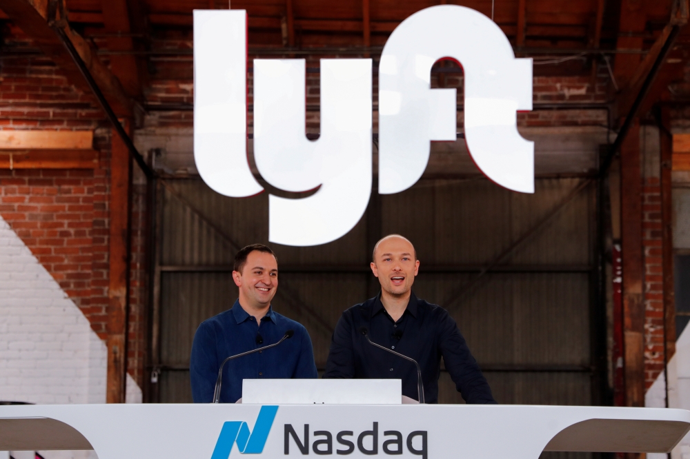 File photo shows Lyft President John Zimmer and CEO Logan Green speak as their company Lyft lists on the Nasdaq at an IPO event in Los Angeles, California, US. — Reuters