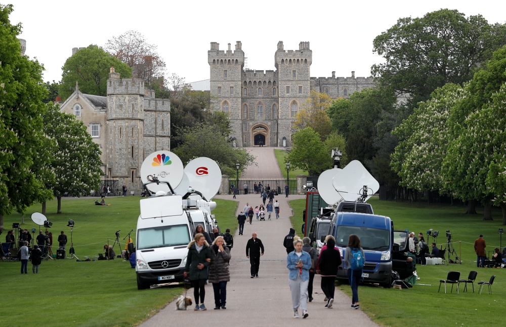 Television satellite trucks are seen parked near Windsor Castle, a day after Meghan, Duchess of Sussex, gave birth to a baby boy, in Windsor, Britain, on Tuesday. — Reuters