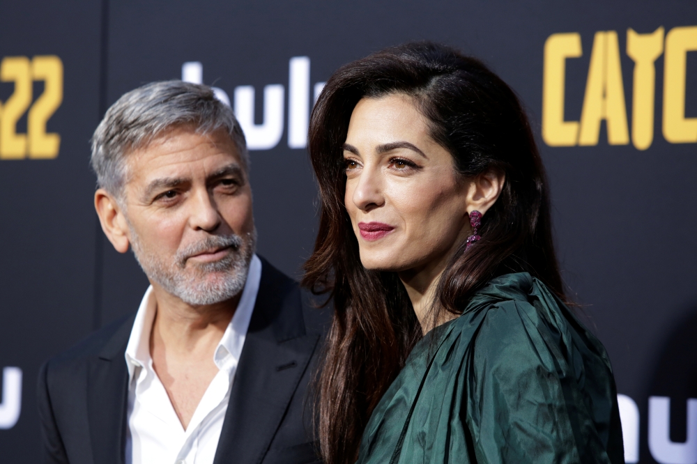 George Clooney arrives with his wife Amal at the premiere of 