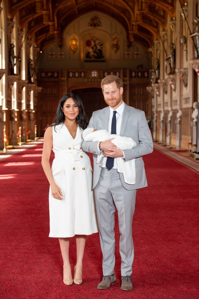 Britain's Prince Harry and Meghan, Duchess of Sussex are seen with their baby son, who was born on Monday morning, during a photocall in St George's Hall at Windsor Castle, in Berkshire, Britain, Wednesday. — Reuters