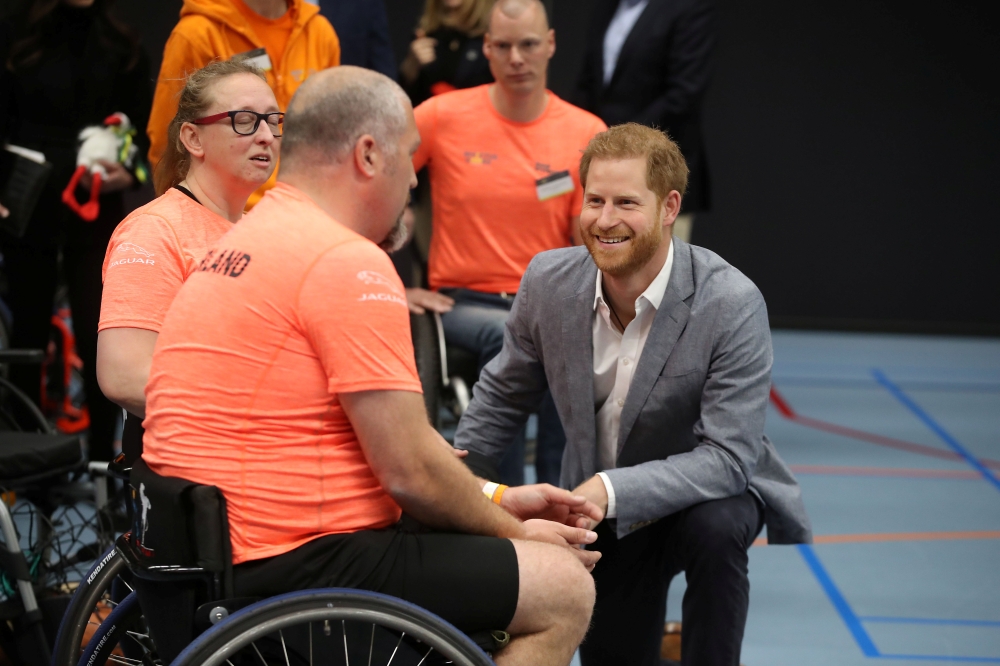 Britain’s Prince Harry speaks with athletes during a sports training session at Sportcampus Zuiderpark during a visit to The Hague as part of a program of events to mark the official launch of of the Invictus Games The Hague 2020 in The Hague, Netherlands, on Thursday. — Reuters