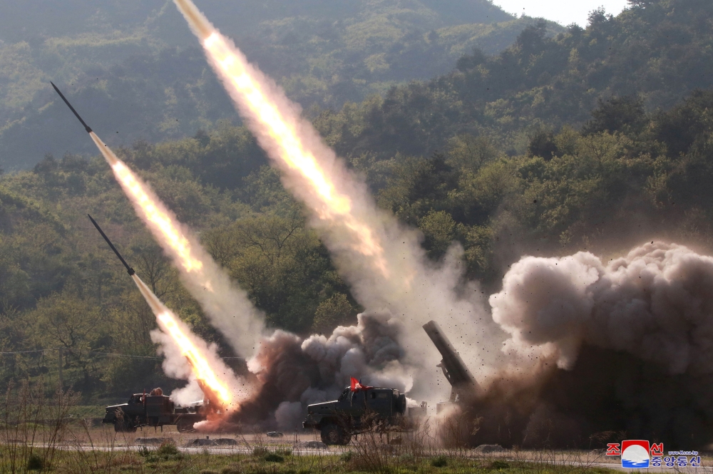 Missiles are seen launched during a military drill in North Korea in this photo supplied by the Korean Central News Agency (KCNA) on Friday. — Reuters