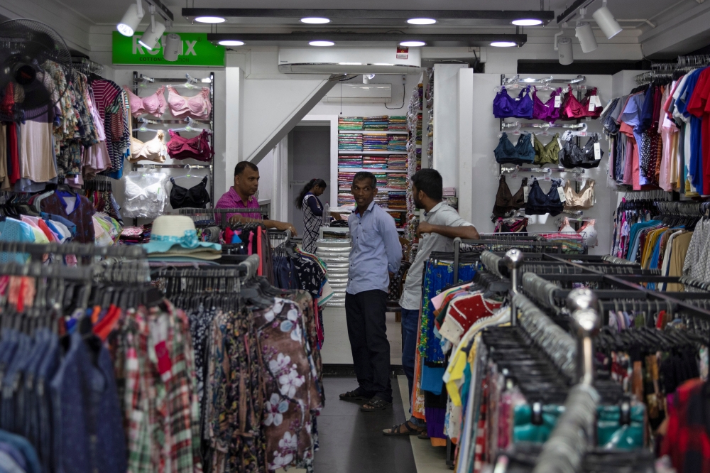 Mohamed Kaleel, the vice-president of the Batticaloa Traders Association, speaks during an interview inside his shop in Batticalao. — Reuters