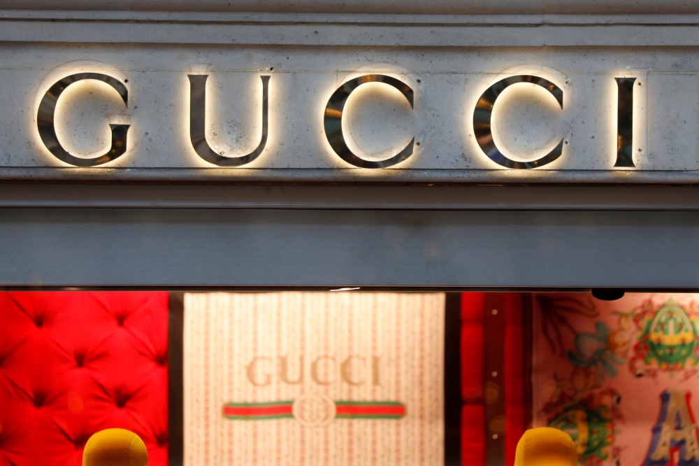 File photo shows a Gucci sign outside a shop in Paris, France. — Reuters