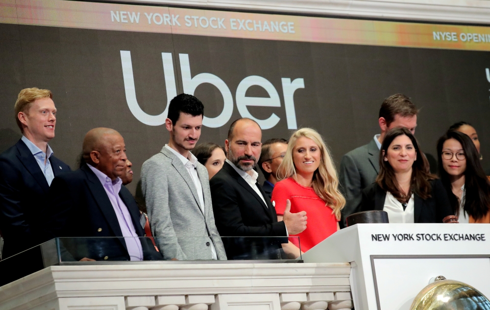 Uber Technologies Inc. CEO Dara Khosrowshah stands on the bell balcony during the opening bell of the trading session on the New York Stock Exchange (NYSE) during the company's IPO in New York, U.S., May 10, 2019. REUTERS/Brendan McDermid