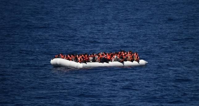 This file photo taken on May 24, 2016 shows refugees waiting on a rubber boat to be rescued during an operation at sea with the Aquarius in the Mediterranean sea in front of the Libyan coast. — AFP