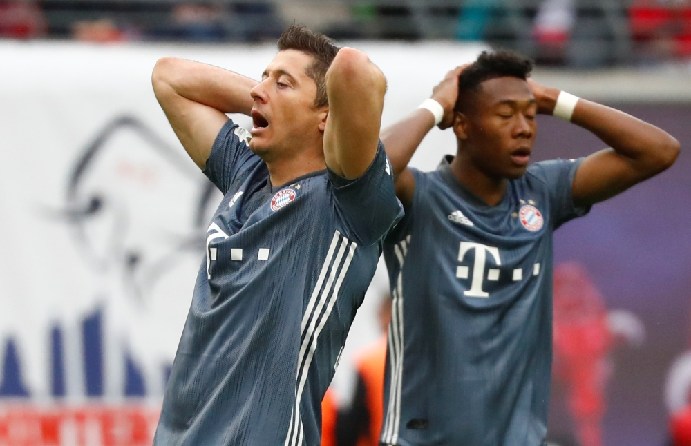 Bayern Munich's Robert Lewandowski and David Alaba react   after the goalless draw with Leipzig at the Red Bull Arena, Leipzig, Germany, on Saturday.  Bayern missed their chance to seal the Bundesliga title. — Reuters