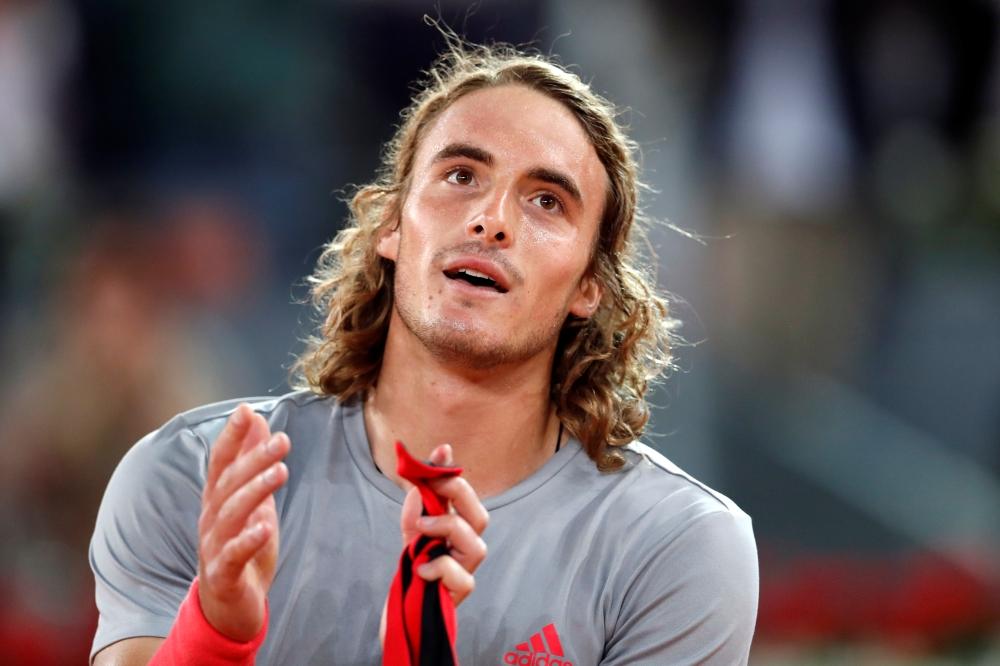 Greece's Stefanos Tsitsipas celebrates winning his semi-final match against Spain's Rafael Nadal at Madrid Open in Spain, on Saturday. — Reuters