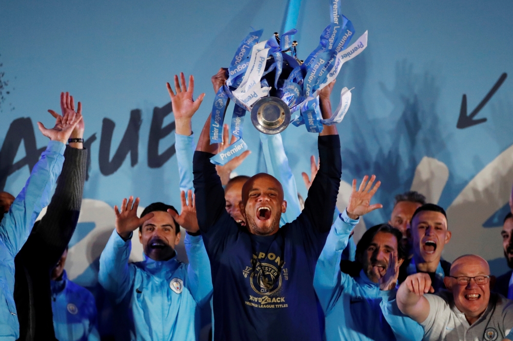 Manchester City's Vincent Kompany celebrates winning the Premier League with the trophy at Etihad Stadium, Manchester, Britain, in this file photo of May 12, 2019. — Reuters