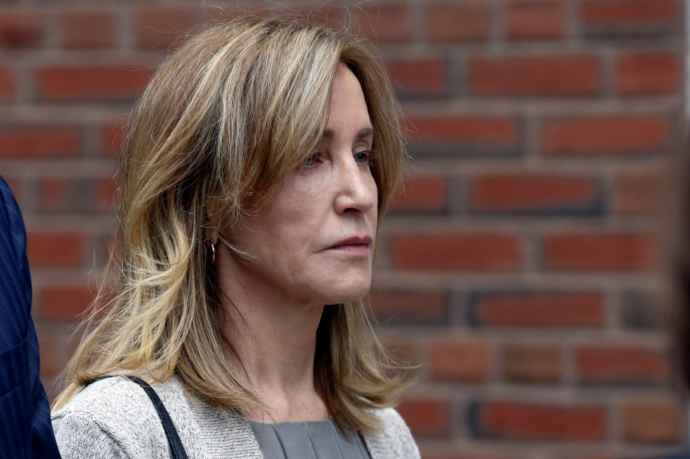 Actor Felicity Huffman leaves the federal courthouse after facing charges in a nationwide college admissions cheating scheme in Boston, Massachusetts, on Monday. — Reuters