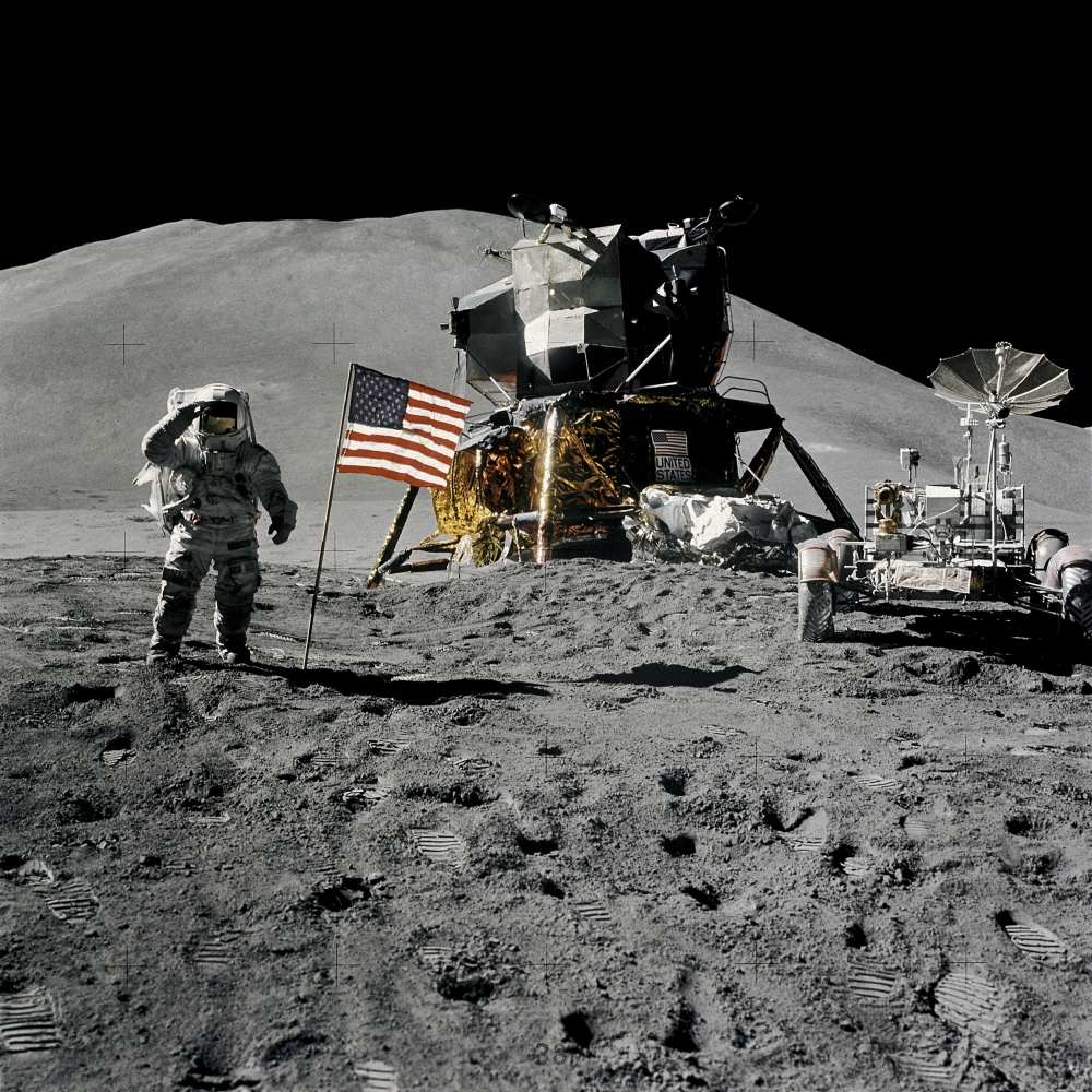 Astronaut James Irwin, lunar module pilot, gives a military salute while standing beside the US flag during Apollo 15 lunar surface extravehicular activity (EVA) at the Hadley-Apennine landing site on the moon on Aug. 1, 1971. — Reuters