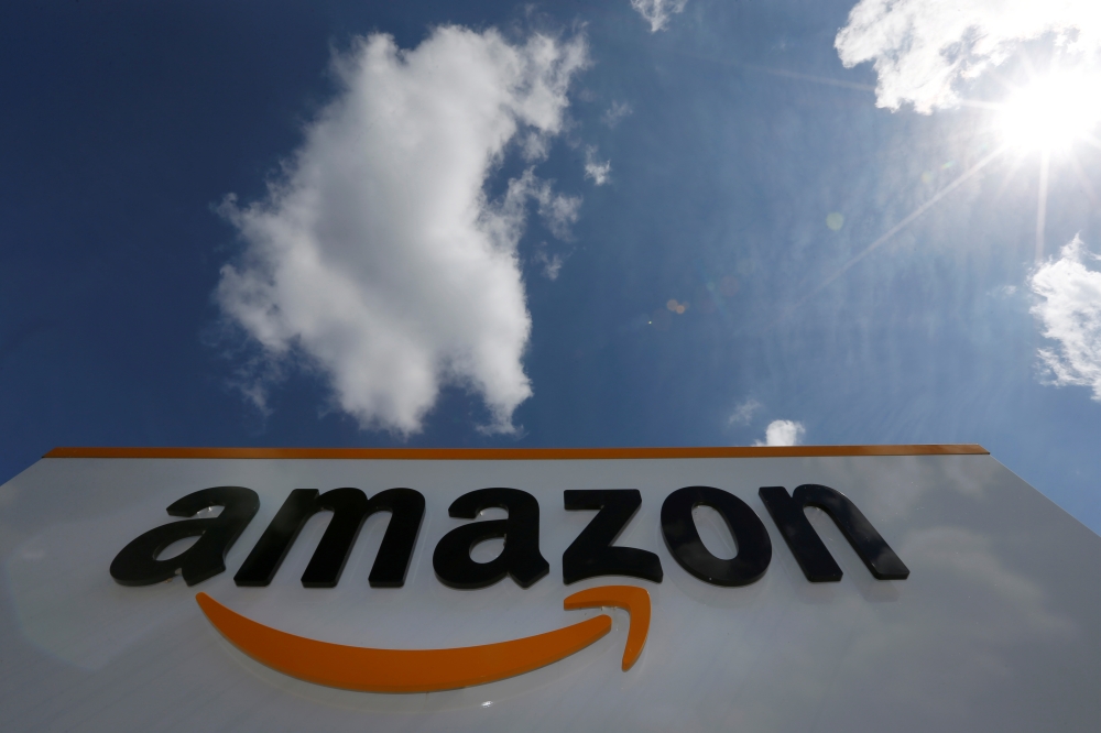 The logo of Amazon is seen at the company logistics centre in Boves, France, on Monday. — Reuters
