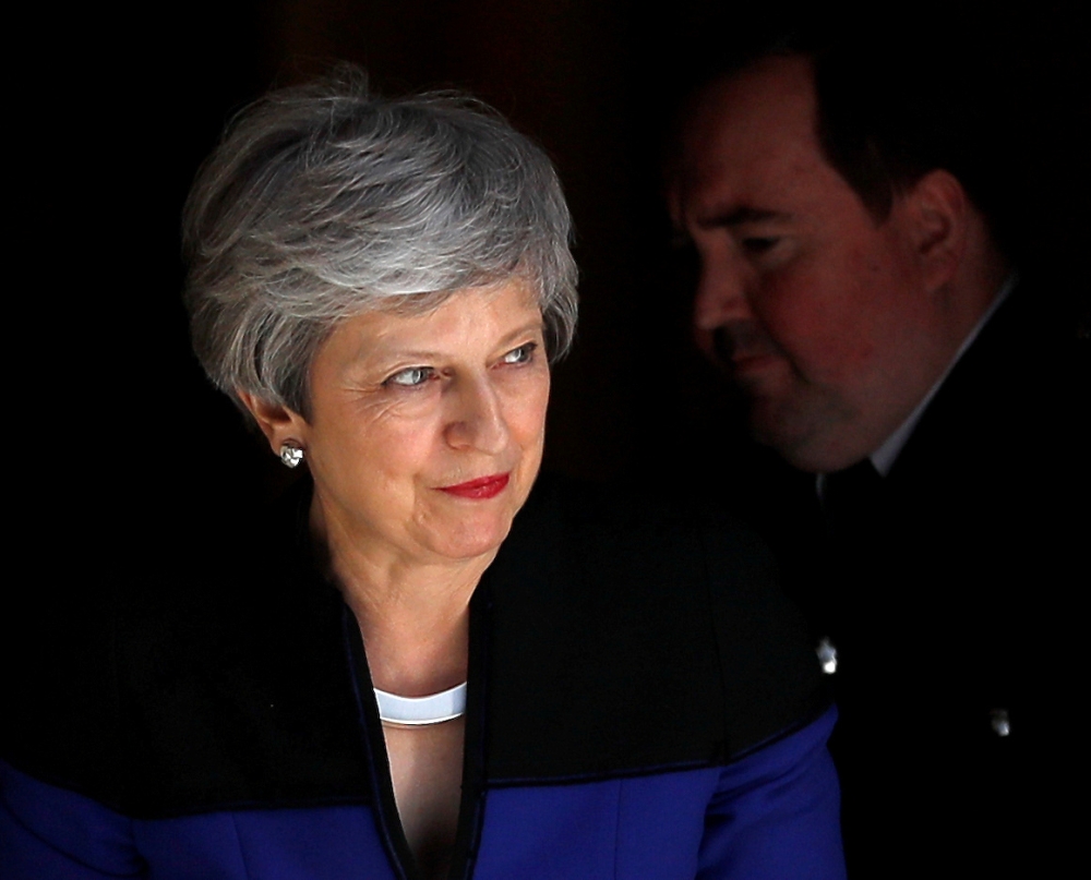 Britain's Prime Minister Theresa May is seen outside Downing Street, in London, Britain, on Tuesday. — Reuters