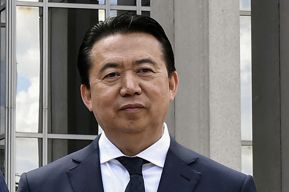 FILE PHOTO: INTERPOL President Meng Hongwei poses during a visit to the headquarters of International Police Organization in Lyon, France, May 8, 2018. - Reuters