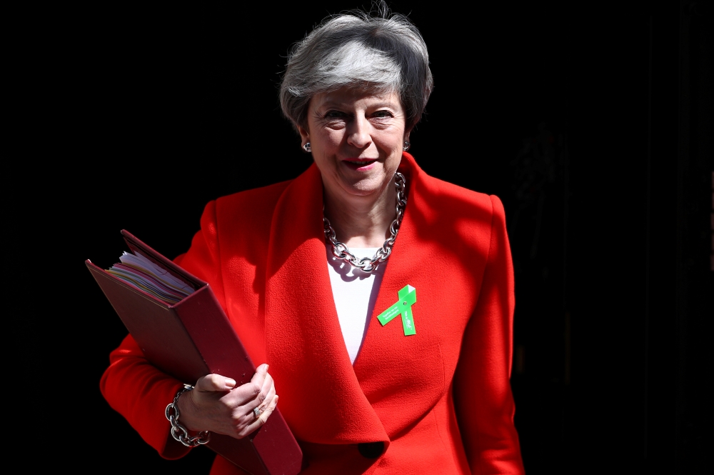 Britain's Prime Minister Theresa May is seen outside Downing Street in London on Wednesday as uncertainty over Brexit continues. — Reuters