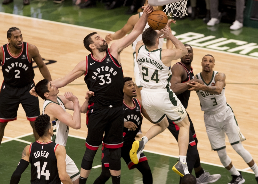 Toronto Raptors center Marc Gasol (33) defends the shot of Milwaukee Bucks guard Pat Connaughton (24) during the third quarter in game one of the Eastern conference finals of the 2019 NBA Playoffs at Fiserv Forum. – Reuters