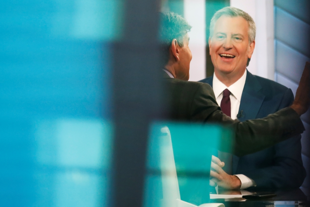 New York City Mayor Bill de Blasio, after announcing his candidacy for the Democratic presidential nomination with a central campaign message, sits on the set of the Good Morning America show in New York City, on Thursday. — Reuters
